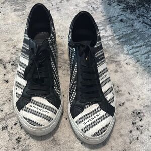 Givenchy. Men’s black & white sneakers, need a good cleaning. Price reflects.